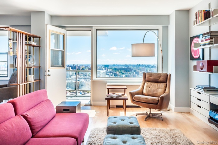 Living area with light hardwood / wood-style flooring