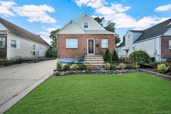 Bungalow-style home featuring brick siding