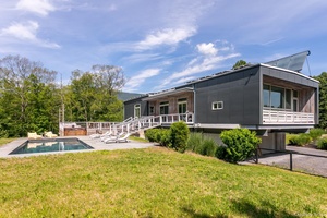 Experience unparalleled privacy and modern elegance at The Catskills Overlook, a luxurious home tucked away on a 13 acre estate surrounded by nature.