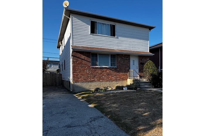 View of front of property with brick siding