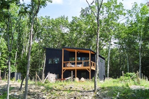 A sleek, modern escape awaits in the beautiful sanctuary of the Black Forest community in Glen Spey, NY.