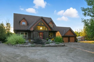Welcome to the log home that redefines country living.
