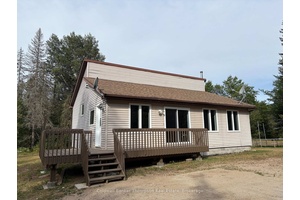 Nestled on a one acre lot, this freshly painted 3 bedroom bungalow offers the perfect blend of privacy and convenience.