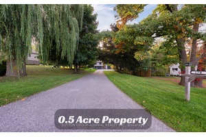 0. 5 ACRE PROPERTY W INSULATED WORKSHOP, Garage, Separate Entrance To The Basement And More !