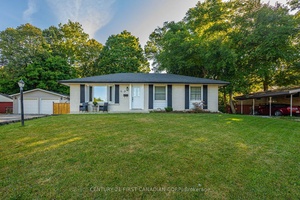 Welcome home to this fabulous all brick bungalow that is perfect for outdoor entertaining !