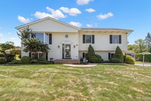 Welcome to 56 Acorn, a four bedroom home situated on a corner lot in a desirable neighborhood.
