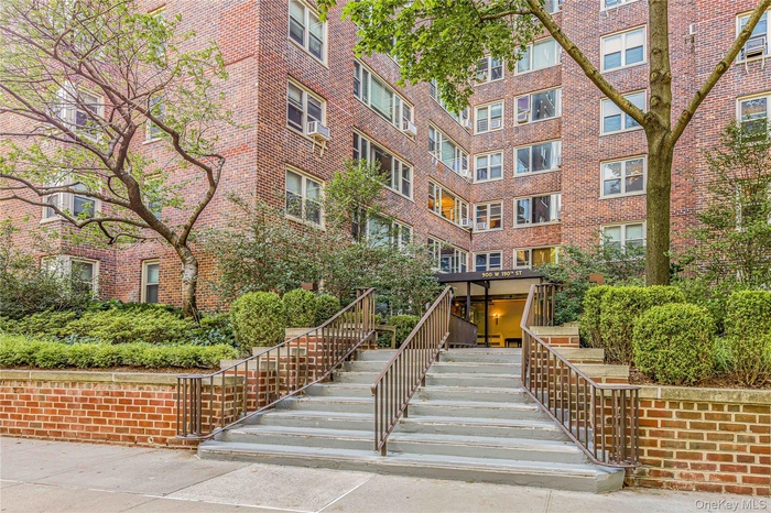 View of apartment building / complex with stairs