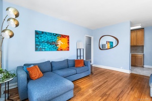 Welcome to this charming, sun filled second floor corner unit in the heart of Sunnyside and Woodside.