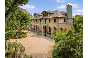 Welcome to 220 Woodside Dr, a spectacular Mediterranean style residence in Hewlett Bay Park.