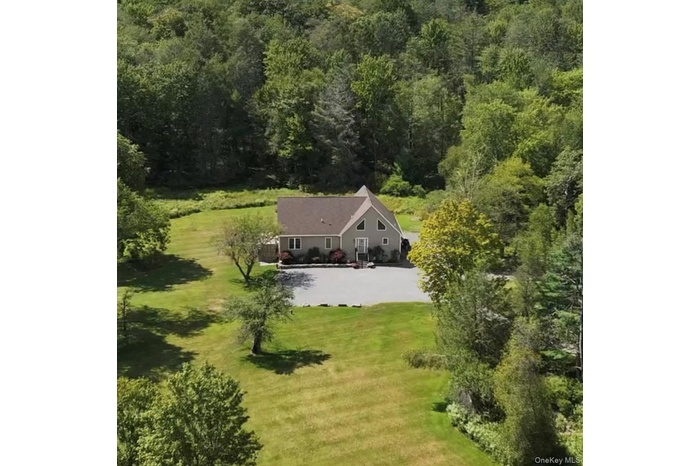 View from above of property with a forest