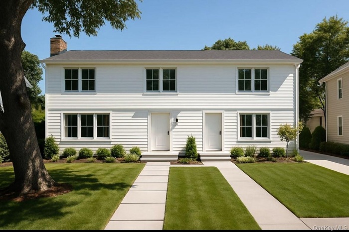 View of front of house with a chimney and a front lawn