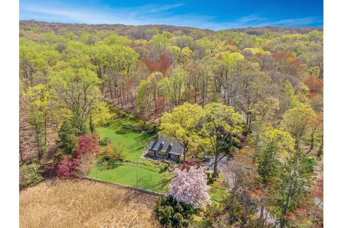 Aerial view of expansive and tucked-away property