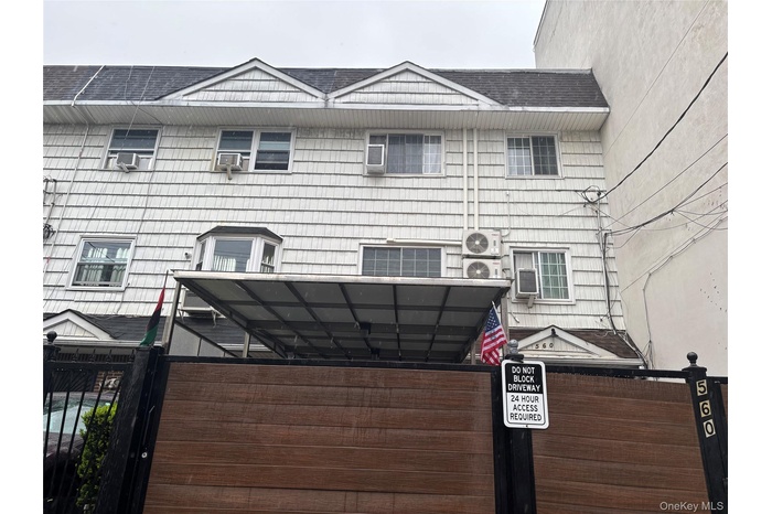 Exterior details featuring cooling unit and fence