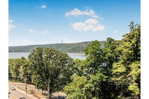 Wake up to sweeping Hudson River views in this move in ready condo at Riverwatch !