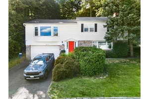 Welcome to this exquisite 3 bedroom, 2 bath raised ranch home tucked away on a picturesque, tree lined street in the desirable Crestwood enclave of Yonkers.