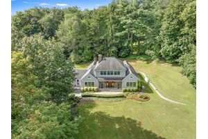 Welcome to 56 Annandale Drive, Chappaqua, a capacious and captivating Cape Cod commandingly set on 1.