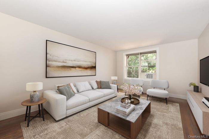 Living room with wood finished floors and baseboards