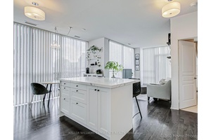 This bright corner suite offers a 1 bedroom, 1 bathroom layout with in suite laundry, featuring a unique open concept design, 9ft ceilings, wood floors, and floor to ceiling windows ...