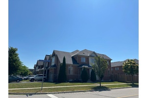 Beautifully updated and sun filled corner unit offering rare 4 bedroom layout on a large lot !