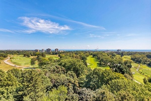 Endless golf course vistas await at this beautifully renovated corner suite in the prestigious The Fairways.