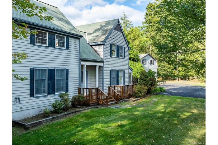 View of front of property with a front lawn