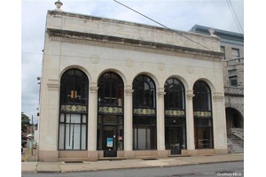 A truly unique opportunity to secure this former bank which contains Soaring Ceiling Heights complemented by its Marble and Granite interior.