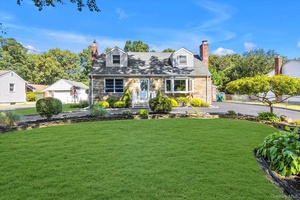 Meticulously maintained and updated cape with legal accessory apartment in finished basement.