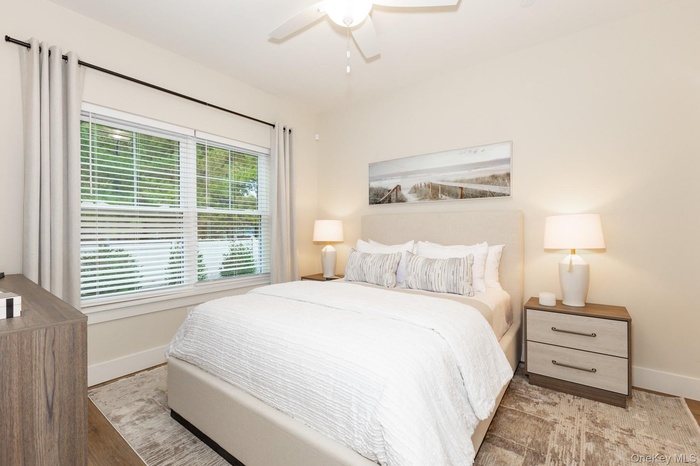 Bedroom featuring ceiling fan and light wood-style floors