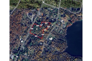 This vacant lot has over 300 feet of Route 42 road frontage and is being combined and sold with the adjacent 2.