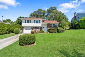 Nestled on a tranquil midblock location in one of Commack's picturesque neighborhoods, this charming 3 bedroom, 2 bathroom split ranch offers exceptional privacy on a generous 0.