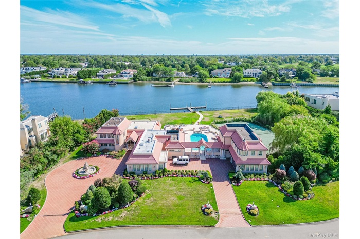 Aerial view of a large body of water and a tree filled landscape