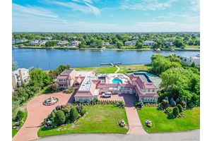 Discover one of the most magnificent waterfront estates in Hewlett Bay Park that redefines luxury living, perfectly nestled on over 2.