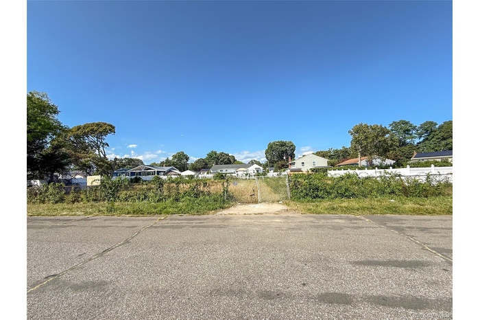 View of asphalt road with a residential view