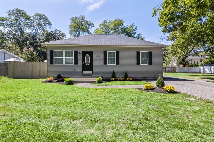 View of front of home with a shingled roof
