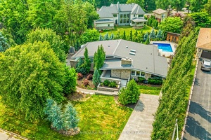 Estate style lot surrounded by mature trees in the gorgeous Bevan Heights location featuring 3 bedrooms with a potential 4th, 5 bathrooms, a Boldt saltwater heated pool, outdoor poolhouse with ...
