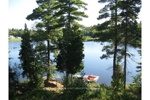 REDUCED TO SELL. GORGEOUS WATERFRONT PROPERTY A CUSTOM BUILT RAISED BUNGALOW IN 2010 ON 2 ACRES IN THE UNORGANIZED TOWN OF MARTEN RIVER.