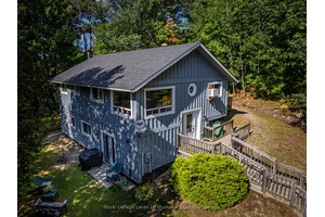 Welcome to this beautifully updated 3 bedroom, 2 bathroom home nestled on a serene 1.
