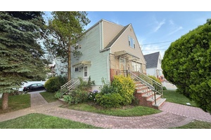 A 2 family residence situated in a tranquil neighborhood near JFK Airport is available for purchase.