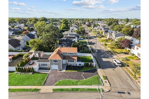 Prime South Merrick Location This Expanded Split Level Home Sits On An Oversized Corner Lot And Offers 3 Spacious Bedrooms And 2 Full Bathrooms.