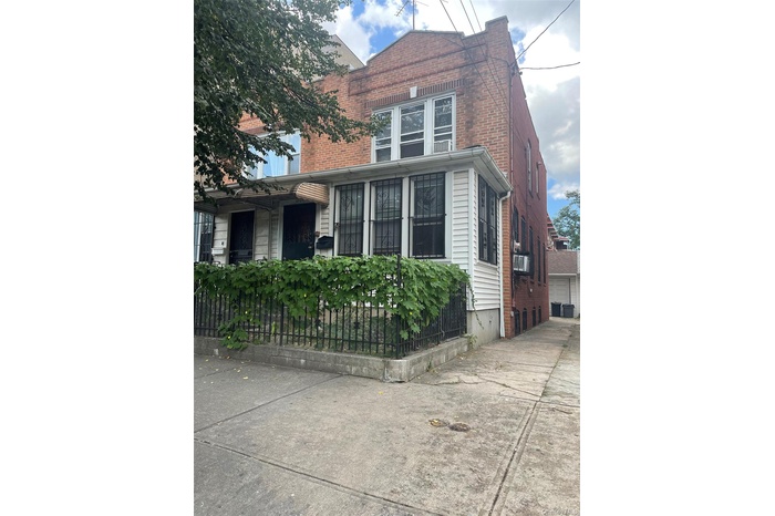 View of side of home with brick siding