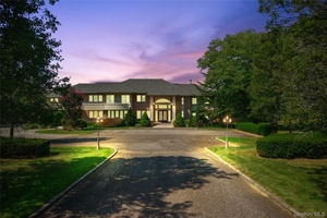 Set along a picturesque, tree lined street, this stately brick colonial offers over 10, 000 square feet of refined living space, gracefully situated on more than four acres of impeccably ...