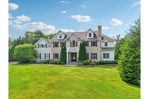 Impeccably Maintained Inside and Out Welcome to this stately and sophisticated 6 bedroom, 5.