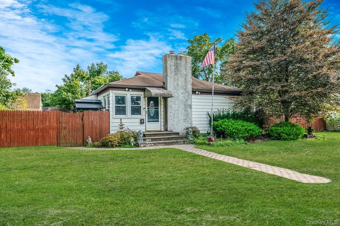 View of front of house with a chimney