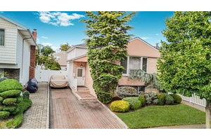 Step inside this unique two family split level and you'll instantly feel the difference.