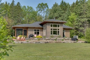 Nestled along the pristine Muskoka River sitting on 1.