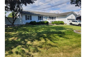 Charming and updated is this custom 3 bedroom Expanded Ranch.
