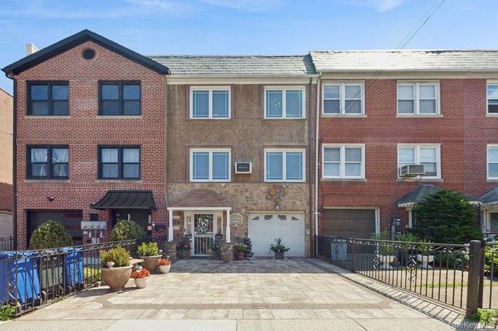 Traditional-style home with 2 car paver driveway