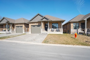 Welcome to Unit 19 at 159 Collins Way, where modern elegance meets effortless living in the desirable town of Strathroy.