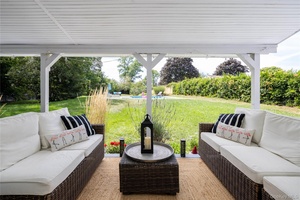 This expansive residence offers a thoughtfully designed layout with a second floor primary suite featuring an ensuite bath and a private balcony overlooking the backyard.