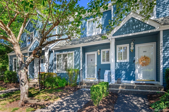 Property entrance featuring roof with shingles